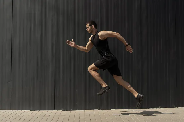 Photo of a man sprinting past a dark wall as a BMP file, 7.6 MB
